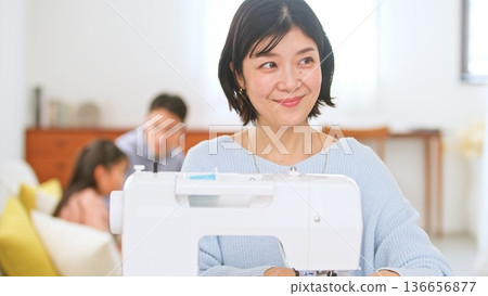 Family conversation sewing machine image Family conversation sewing machine image 136656877