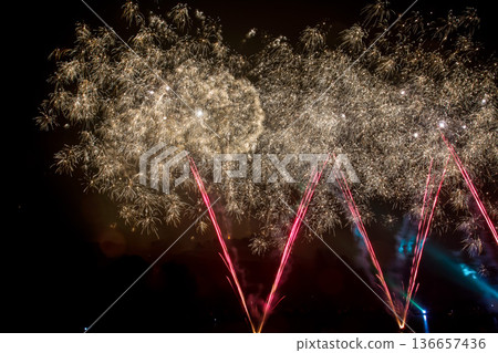 The colorful light of fireworks at Munich Olympiapark, Germany The colorful light of fireworks at Munich Olympiapark, Germany 136657436