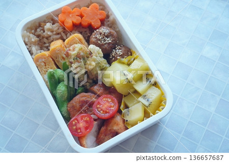 Colorful handmade bento lunch boxes with fruit 136657687