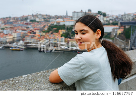 portrait of a teenage girl standing on the embankment portrait of a teenage girl standing on the embankment 136657797