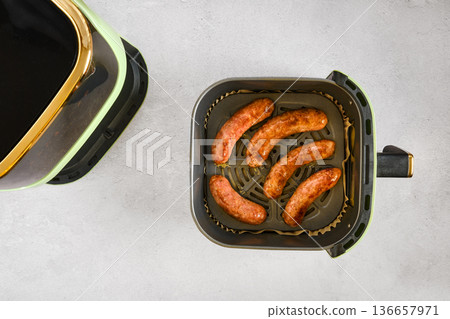 Cooking natural casing sausages in air fryer for a simple and tasty meal 136657971