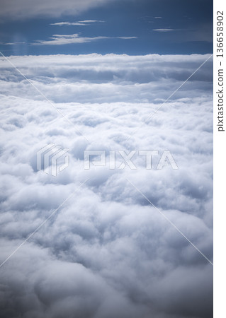 A view shows thick clouds spread across the sky. Blue areas peek through the clouds in the background. Daylight shines on this scene from above the earth. High quality photo A view shows thick clouds spread across the sky. Blue areas peek through the clouds in the background. Daylight shines on this scene from above the earth. High quality photo 136658902