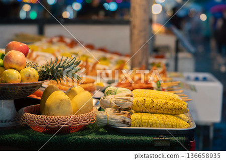 Mango corn pineapple and other vegetables at the Thai traditional night market in Bangkok, street food street photo. High quality photo Mango corn pineapple and other vegetables at the Thai traditional night market in Bangkok, street food street photo. High quality photo 136658935