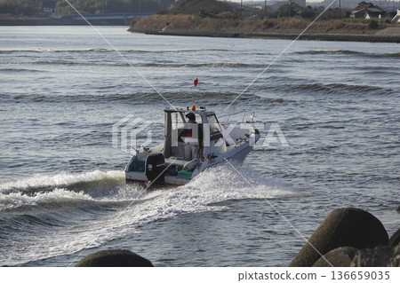 A small boat with an outboard motor that runs on rivers A small boat with an outboard motor that runs on rivers 136659035