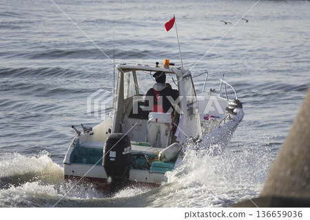 A small boat with an outboard motor that runs on rivers A small boat with an outboard motor that runs on rivers 136659036