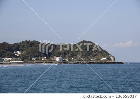 The view of the cape from the opposite shore. You can see the small white lighthouse. 136659037