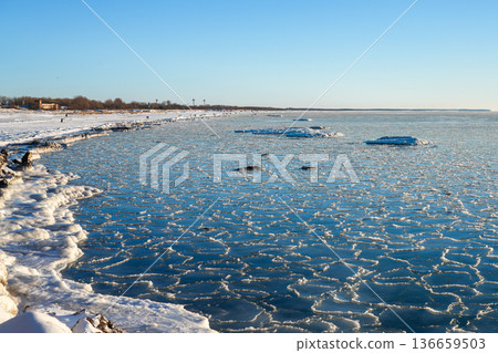 Frozen Baltic Sea Shoreline in Liepaja Latvia with Drift Ice and Snowy Winter Coast Frozen Baltic Sea Shoreline in Liepaja Latvia with Drift Ice and Snowy Winter Coast 136659503