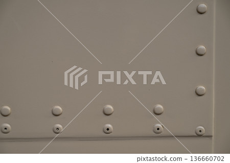 Riveted metal plate texture background 136660702