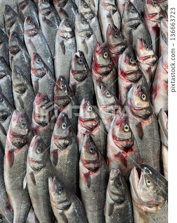 Fresh fish selling at a market counter Fresh fish selling at a market counter 136663723