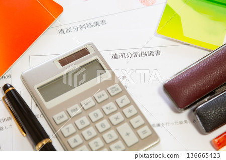 Inheritance division agreement, calculator, seal, pen, bankbook. Property division, inheritance, money image. Inheritance division agreement, calculator, seal, pen, bankbook. Property division, inheritance, money image. 136665423