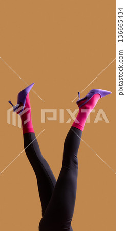 Female legs in pink socks and purple high heels playful pose on beige background. 136665434