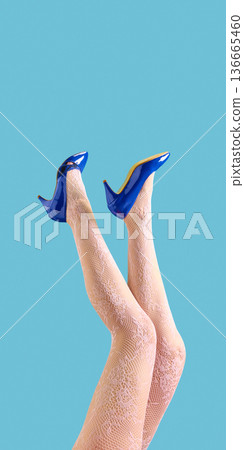 Female legs in lace tights and blue high heels on blue background. Female legs in lace tights and blue high heels on blue background. 136665460