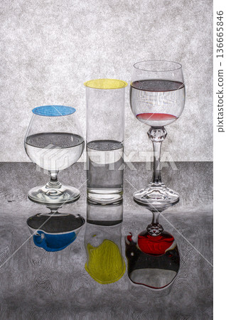 Still life with glass goblets containing liquid and reflection Still life with glass goblets containing liquid and reflection 136665846