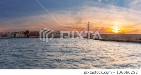 Sunset over Venetian Harbor and Lighthouse in Chania Crete Greece Sunset over Venetian Harbor and Lighthouse in Chania Crete Greece 136666258