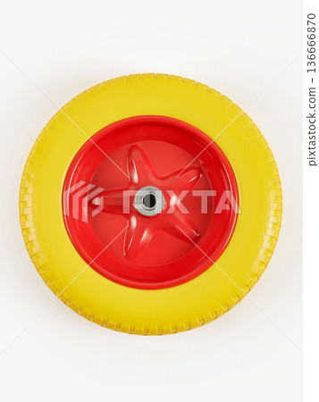 Wheel is pneumatic on a white background. Yellow rubber, red disc. 136666870