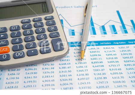 Pencil and calculator on chart or graph paper. Financial, account, statistics and business data. Pencil and calculator on chart or graph paper. Financial, account, statistics and business data. 136667075