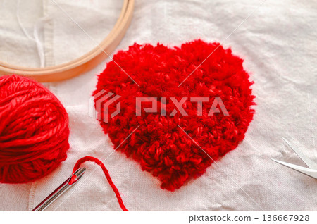 Red heart craft made with punch needles Red heart craft made with punch needles 136667928