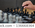 White chess pieces on board with selective focus on King. Leadership concept, business strategy planning, corporate management, competition success, vision for victory and organizational challenge. 136668364