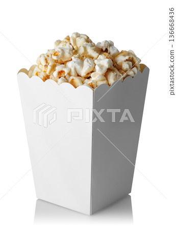 Popcorn in paper bucket isolated on white background Popcorn in paper bucket isolated on white background 136668436