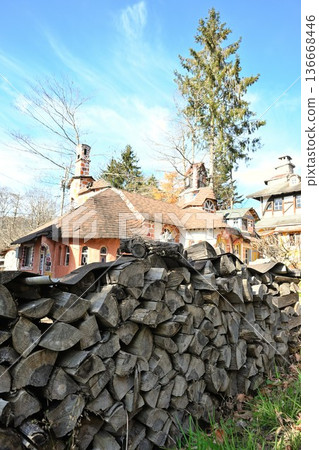 Exterior of a brick house with firewood piled up Exterior of a brick house with firewood piled up 136668446