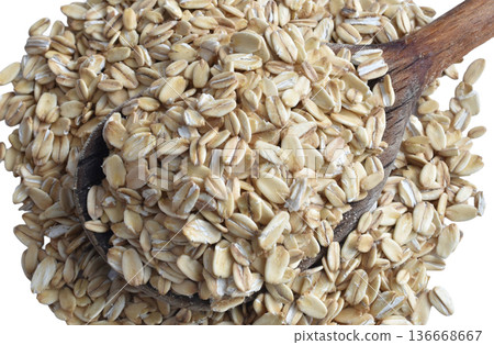 Oatmeal lies in a wooden spoon. Oatmeal lies in a wooden spoon. 136668667
