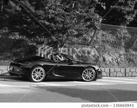 shiny black open car shiny black open car 136668943