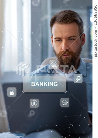 Man using laptop to process banking invoice payment at home office in the afternoon Man using laptop to process banking invoice payment at home office in the afternoon 136668950
