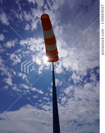 Windsock fluttering in the wind Windsock fluttering in the wind 136669087