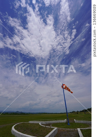 Windsock fluttering in the wind Windsock fluttering in the wind 136669089
