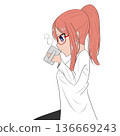A woman in a white coat sitting and drinking a drink 136669243
