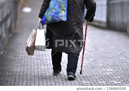 Yokohama cityscape in Japan: Downhill... After the stairs comes a steep downhill... Aging society: Elderly woman with a cane = Yokohama city 136669388