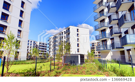 Residential building. bottom view. Modern apartment building on a sunny day. Facade of a modern apartment building. Residential building. bottom view. Modern apartment building on a sunny day. Facade of a modern apartment building. 136669428