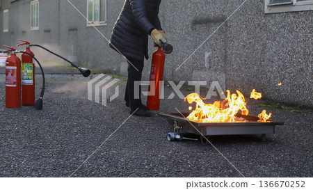 corporate safety - exercise during a firefighting course 136670252