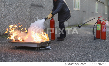 corporate safety - exercise during a firefighting course 136670255