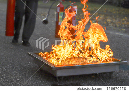 corporate safety - exercise during a firefighting course 136670258