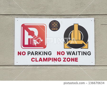 No parking and no waiting signs with clamping zone notices displayed at location No parking and no waiting signs with clamping zone notices displayed at location 136670634