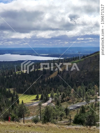Panoramic view of the lake and forest from the ski slope Panoramic view of the lake and forest from the ski slope 136671527