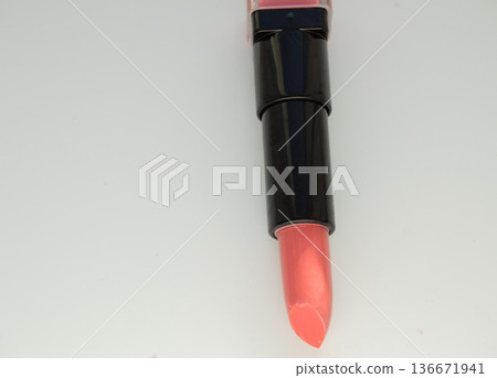 Pink lipstick, open the tube on a white background Pink lipstick, open the tube on a white background 136671941