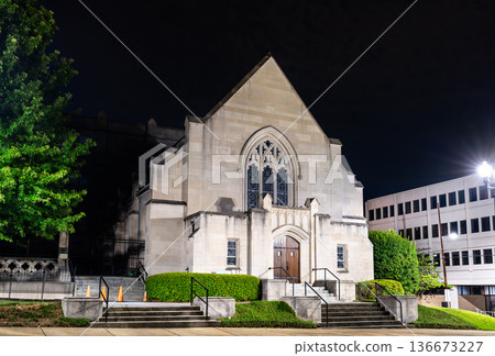 Galloway United Methodist Church chapel in Jackson Mississippi. Historic stone religious architecture features a Gothic Revival facade with a pointed arch window 136673227