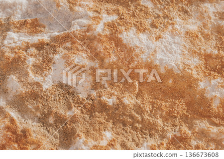 Close-up of natural stone texture with coral and ginger orange tones. Rough rocky surface pattern Close-up of natural stone texture with coral and ginger orange tones. Rough rocky surface pattern 136673608