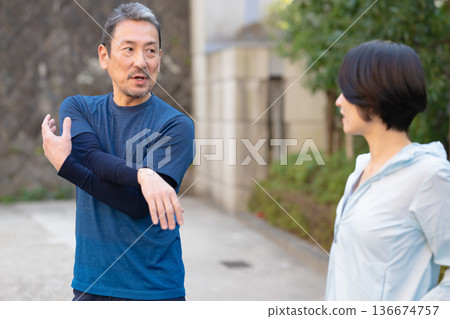 Men and women exercising Men and women exercising 136674757