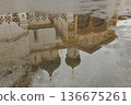 Wet asphalt and an ancient church, reflection, inverted image 136675261