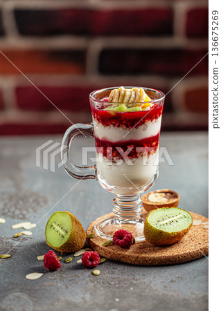 Layered yogurt parfait with berries and kiwi Layered yogurt parfait with berries and kiwi 136675269