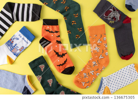 Socks pattern. Bright cheerful sock without a pair top view. A set of different colored socks. Clothes and style background 136675305