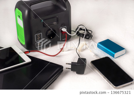 Charging station. A large power bank battery in the absence of electricity. Charging station. A large power bank battery in the absence of electricity. 136675321