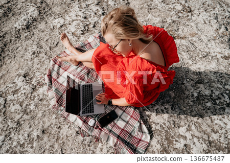 Woman Working on Laptop Outdoors Woman Working on Laptop Outdoors 136675487
