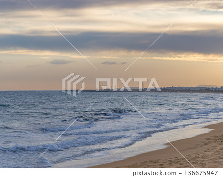 Serene Solitude: Dramatic Skies over Empty Tunisian Shores 136675947