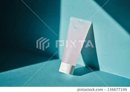 Skincare cosmetic tube standing on blue background 136677199