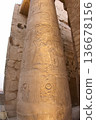 Stone pillars at Luxor Temple with intricate reliefs 136678156