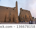Panoramic view of the First Pylon, Colossus of Ramses II and Obelisk of Luxor Temple, Egypt 136678158